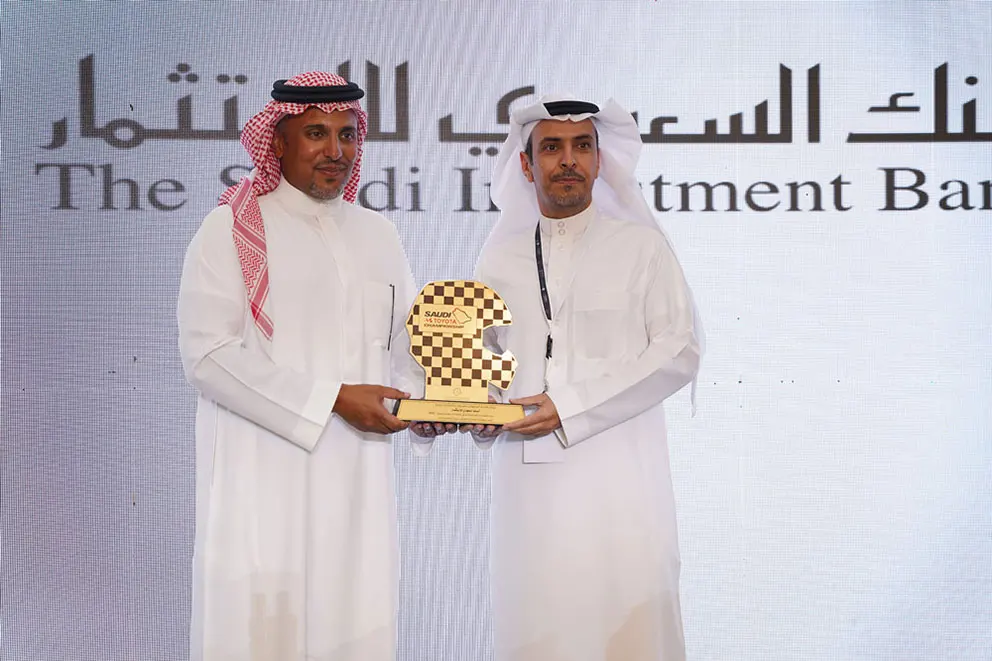 HRH Prince Khalid bin Sultan Al-Faisal hands over the honorary shield to Mr. Salman bin Bader Al Fughom, Deputy CEO of The Saudi Investment Bank, the strategic partner of the Saudi Toyota Championship